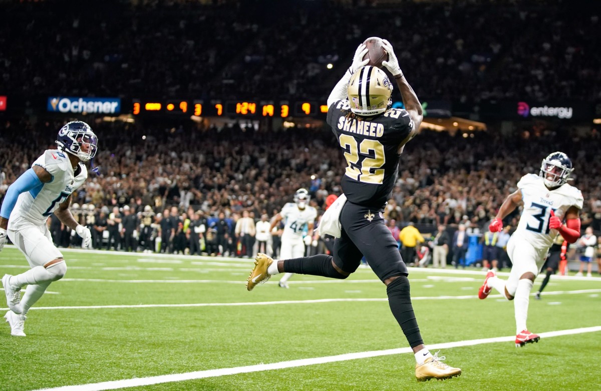 New Orleans Saints back Tony Baker grabs a pass for seven yards in