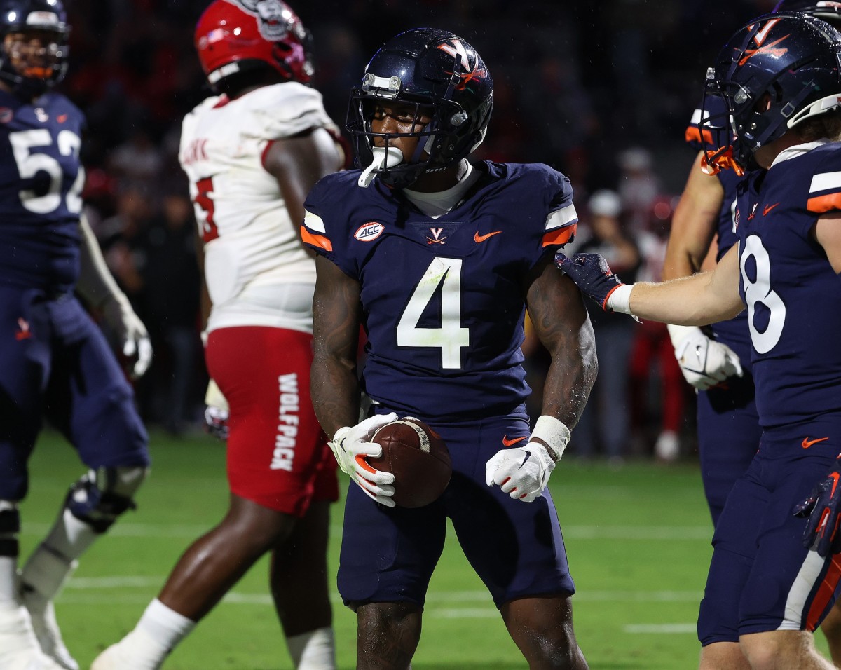 UVA wide receiver Malik Washington celebrates after a catch during the Virginia football game against NC State at Scott Stadium.