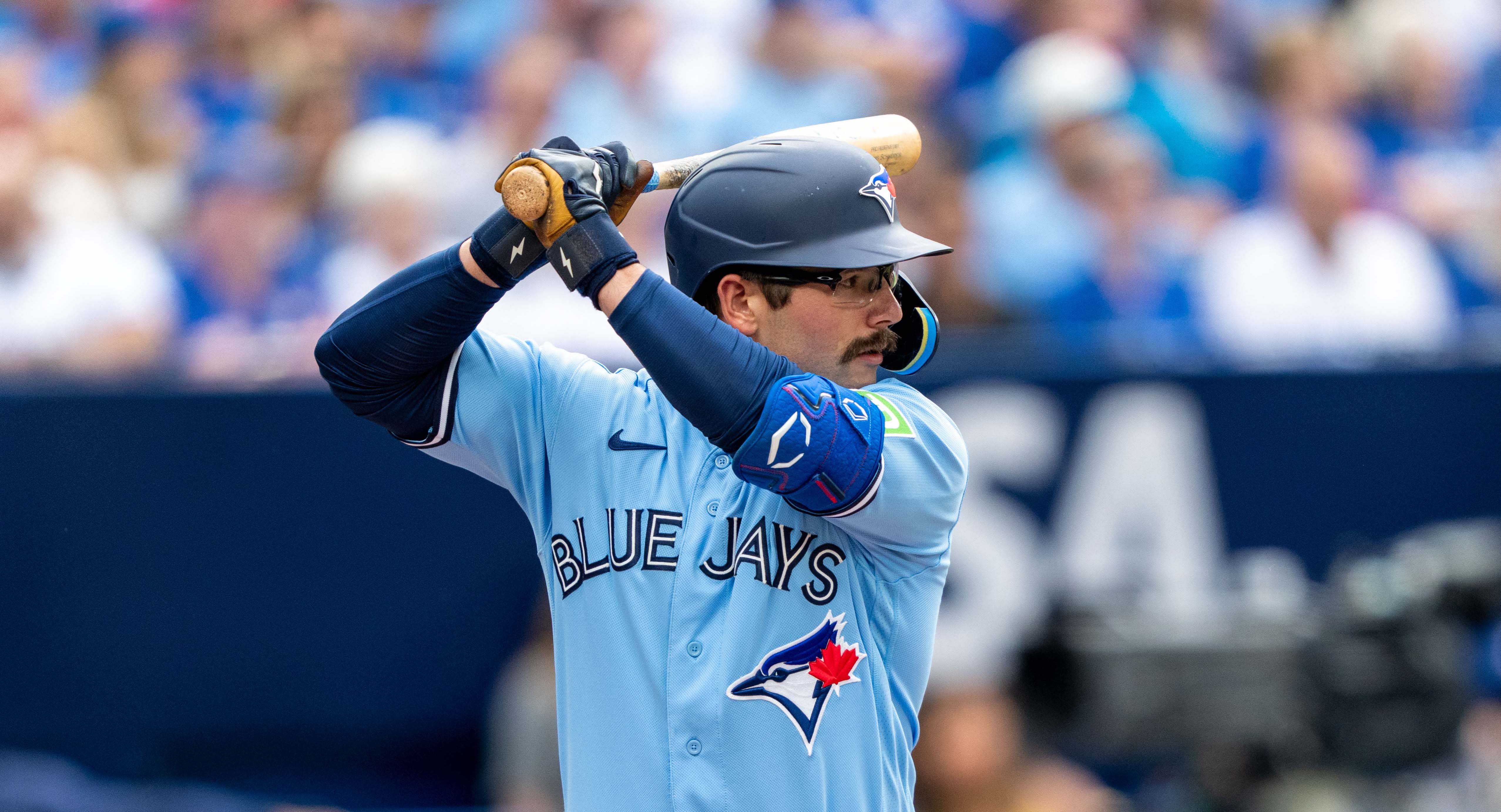 Toronto Blue Jays second baseman Davis Schneider (11) steams third