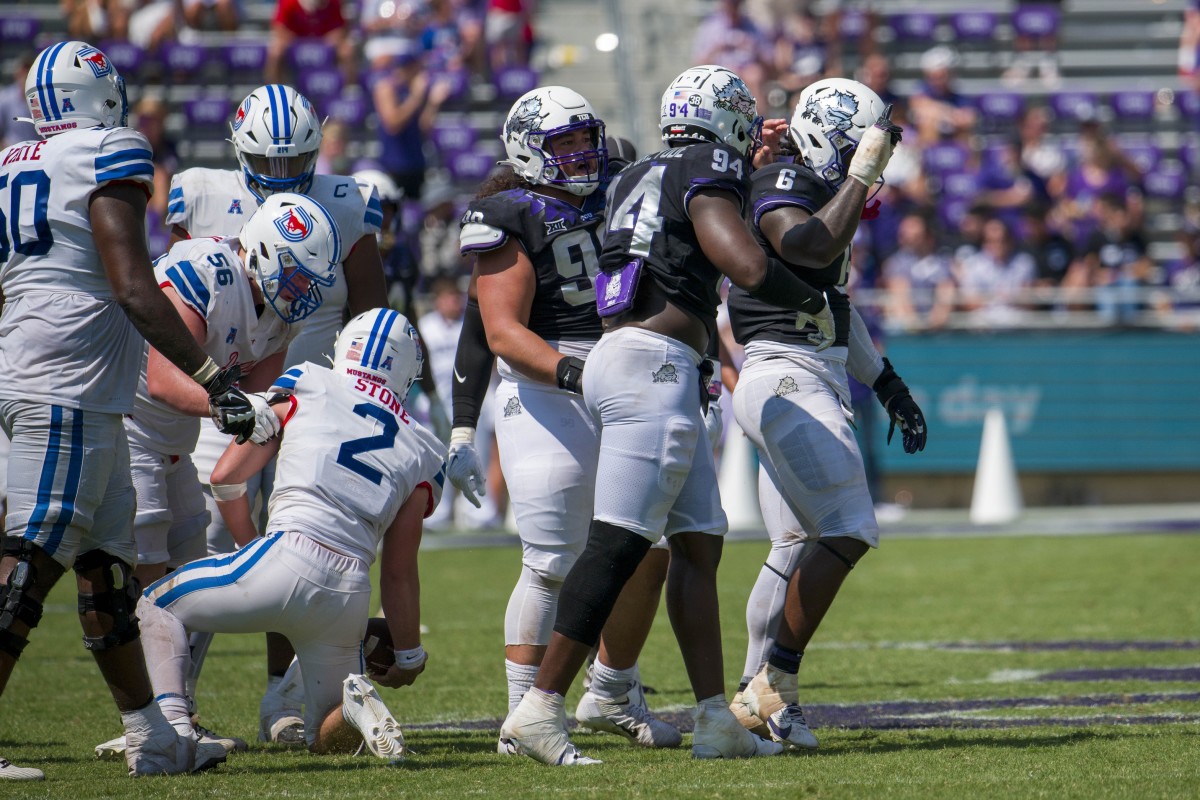 Sep 23, 2023; Fort Worth, Texas, USA; TCU Horned Frogs defensive lineman Soni Misi (99) and defensive lineman Micheal Ibukun-Okeyode (94) and linebacker Jamoi Hodge (6) celebrate after a sack of SMU Mustangs quarterback Preston Stone (2) during the second half at Amon G. Carter Stadium.