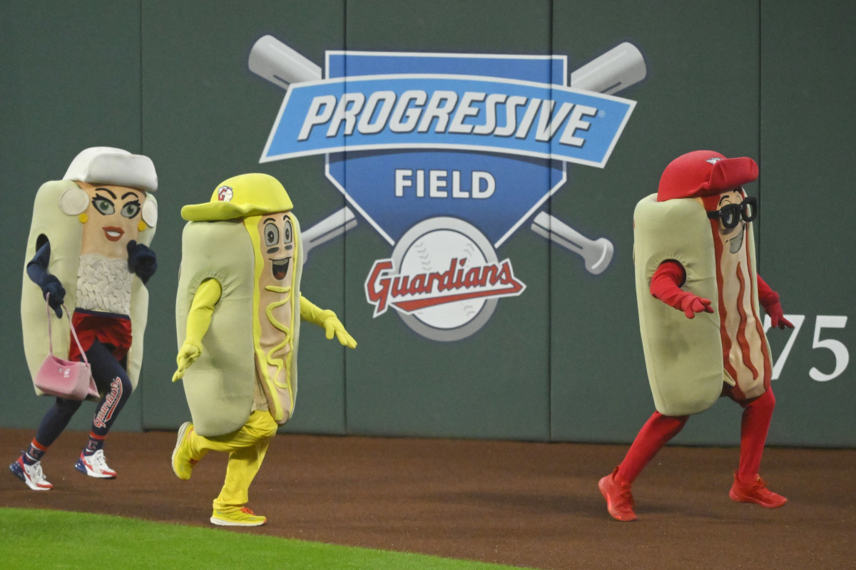 Aug 7, 2023; Cleveland, Ohio, USA; Hot dog mascots run between innings of a game between the Cleveland Guardians and the Toronto Blue Jays at Progressive Field. Mandatory Credit: David Richard-USA TODAY Sports