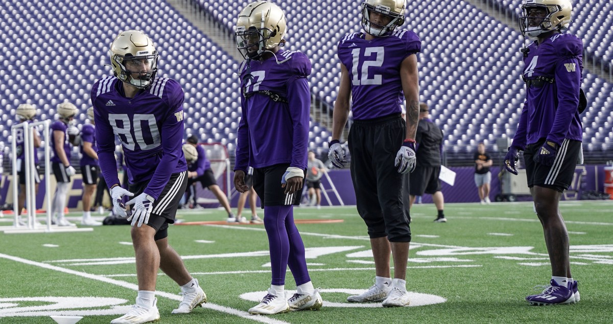 Jake Parnagian (80), shown with UW receivers Giles Jackson (0), Denzel Boston (12) and Germie Bernard (4), made his Husky debut against Cal.