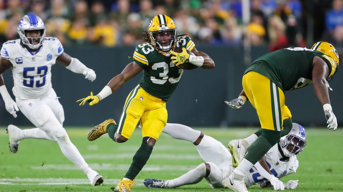 Aaron Jones of the Green Bay Packers runs with the ball in the third  Green  bay packers, Green bay packers pictures, Green bay packers football