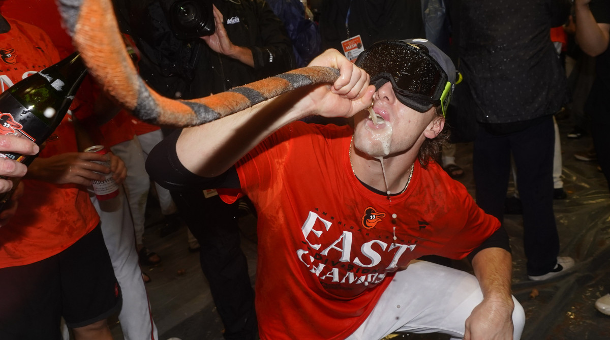 Orioles third baseman Gunnar Henderson drinks from the "Homer Hose" while celebrating his team's 2023 AL East championship