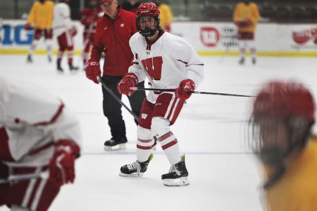 Wisconsin hockey player Caroline Harvey goes through practice as Badgers coach Mark Johnson watches on Tuesday Sept. 26, 2023 at La Bahn Arena in Madison, Wis.