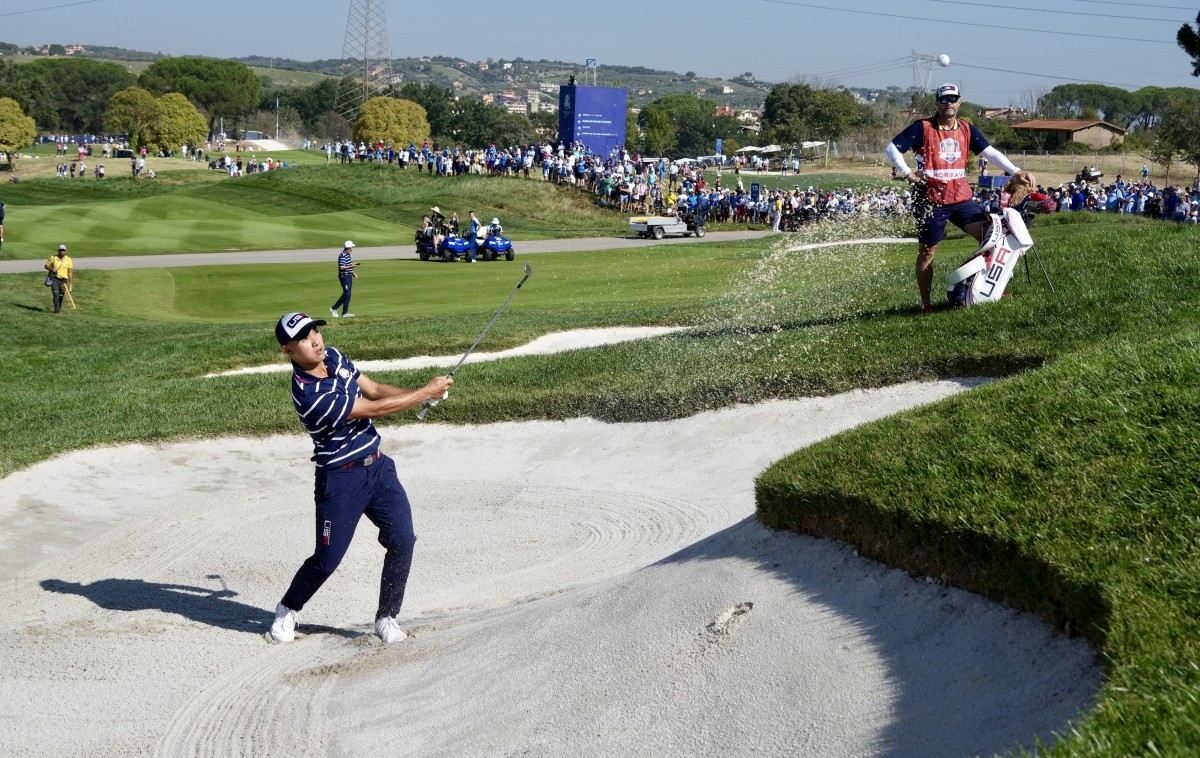 Collin Morikawa hits out of a bunker at the Ryder Cup