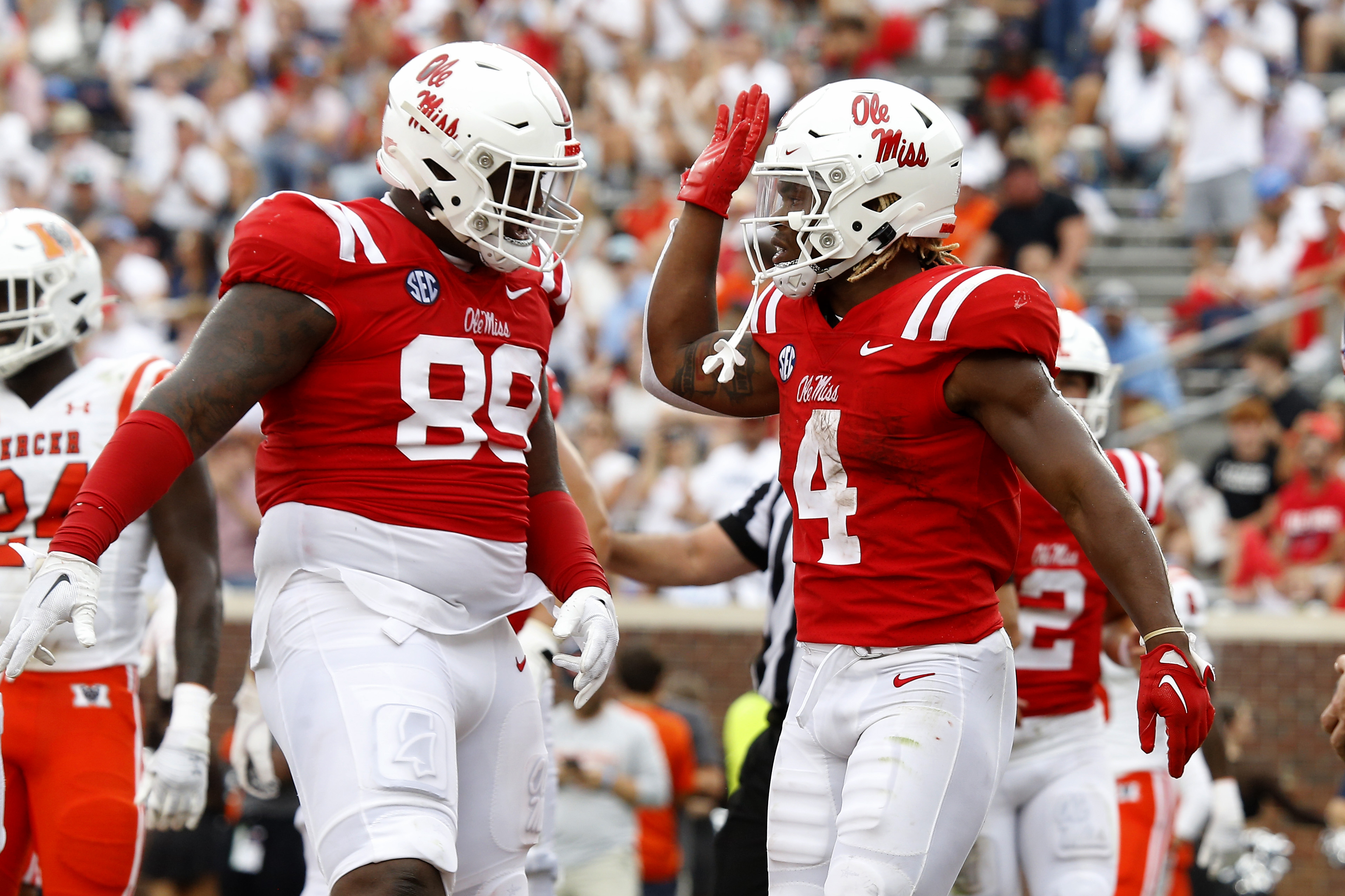 Sep 2, 2023; Oxford, Mississippi, USA; Mississippi Rebels running back Quinshon Judkins (4) reacts with Mississippi Rebels defensive linemen JJ Pegues (89) after a touchdown during the second half against the Mercer Bears at Vaught-Hemingway Stadium. Mandatory Credit: Petre Thomas-USA TODAY Sports