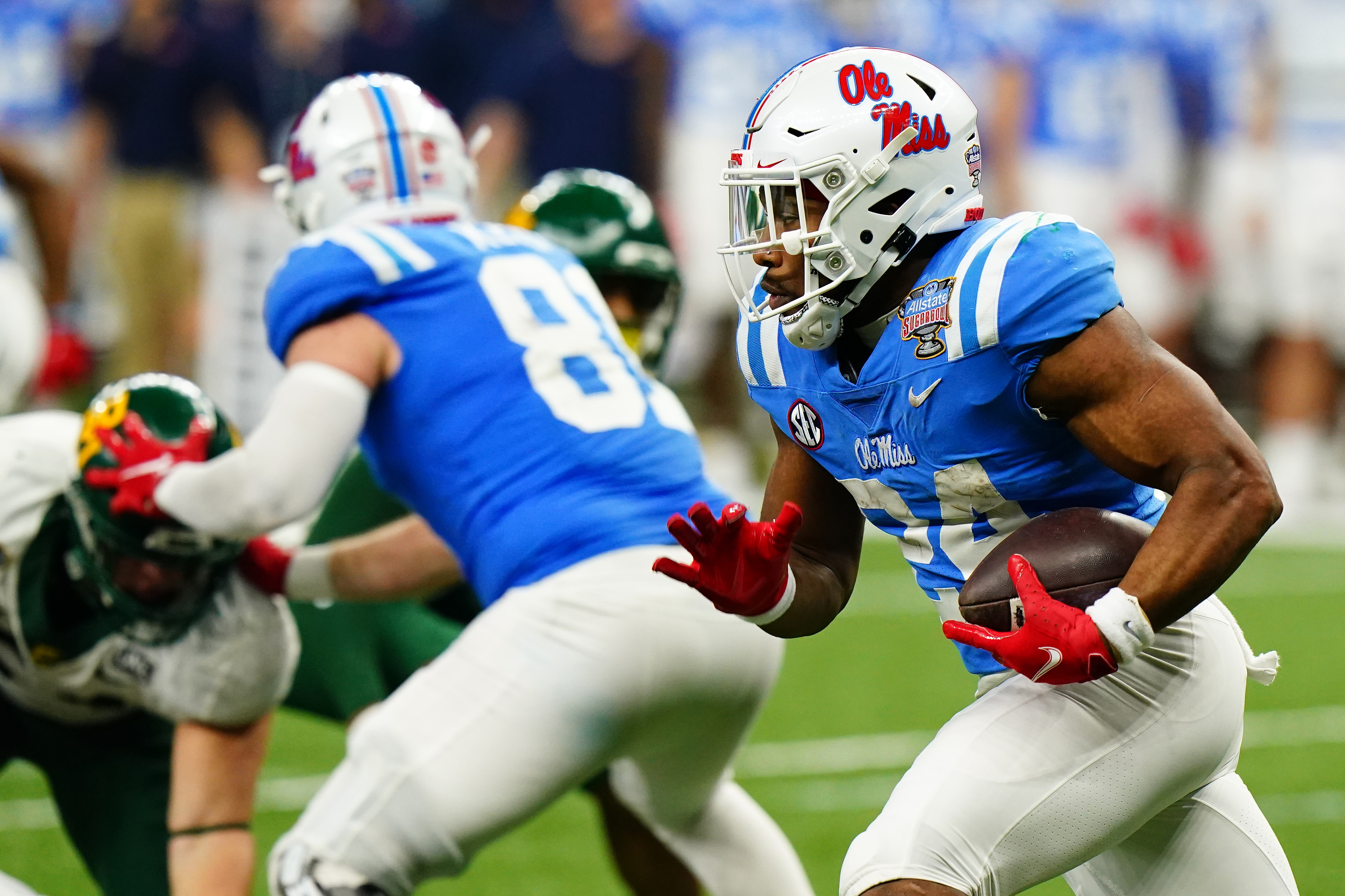 Jan 1, 2022; New Orleans, LA, USA; Mississippi Rebels running back Snoop Conner (24) runs with the ball against the Baylor Bears during the second half in the 2022 Sugar Bowl at Caesars Superdome. Mandatory Credit: John David Mercer-USA TODAY Sports