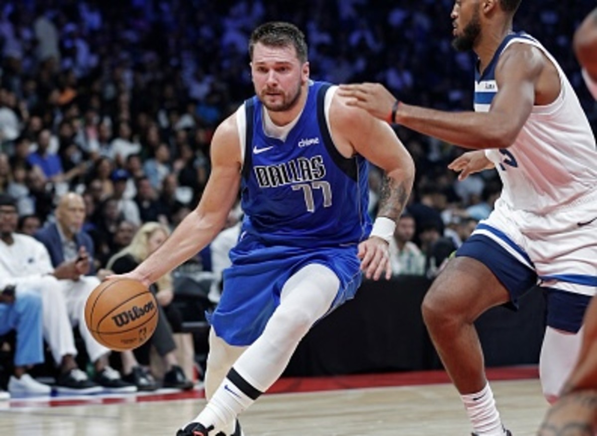 Why does Luka Doncic wear the number 77?