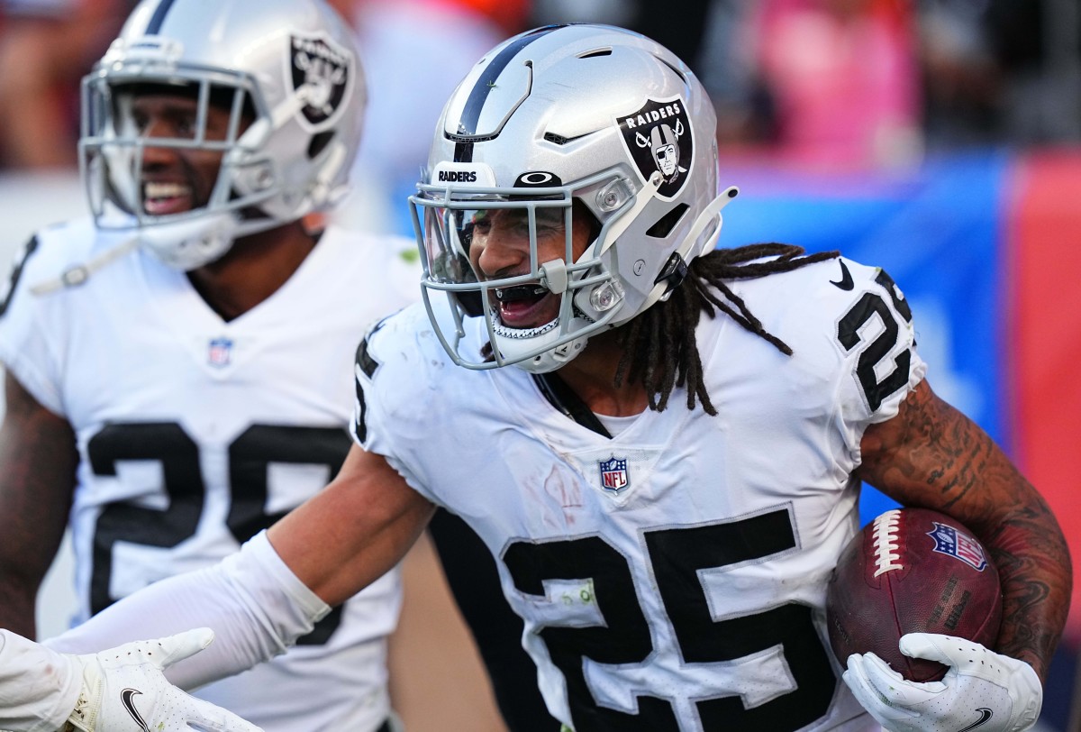 Oct 17, 2021; Denver, Colorado, USA; Las Vegas Raiders free safety Trevon Moehrig (25) celebrates his interception in the fourth quarter against the Denver Broncos at Empower Field at Mile High. Mandatory Credit: Ron Chenoy-USA TODAY Sports