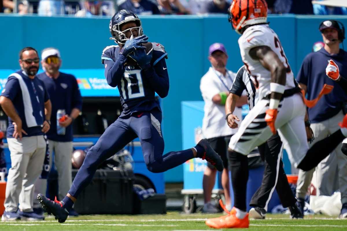 Tennessee Titans wide receiver DeAndre Hopkins (10) receives a pass for a first down against the Cincinnati Bengals during the second quarter at Nissan Stadium in Nashville, Tenn., Sunday, Oct. 1, 2023.