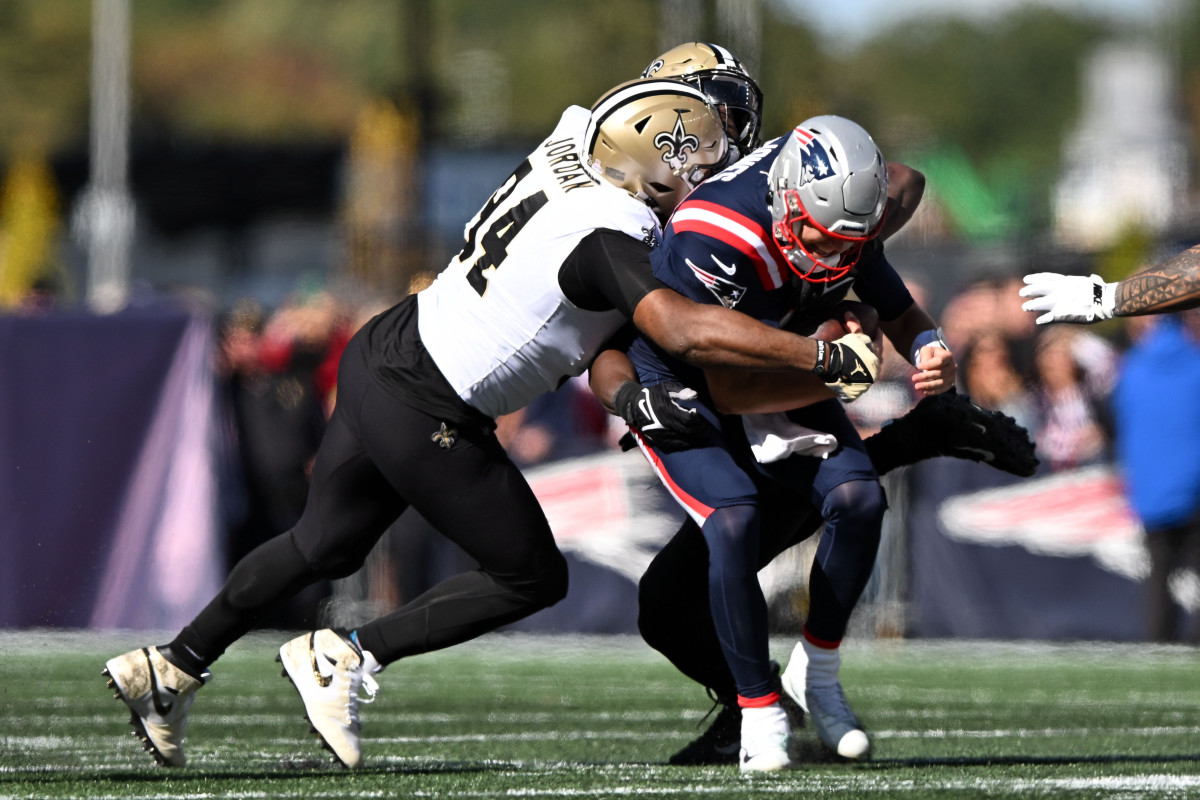 New England Patriots quarterback Mac Jones is sacked by New Orleans Saints’ Cameron Jordan in Week 5.