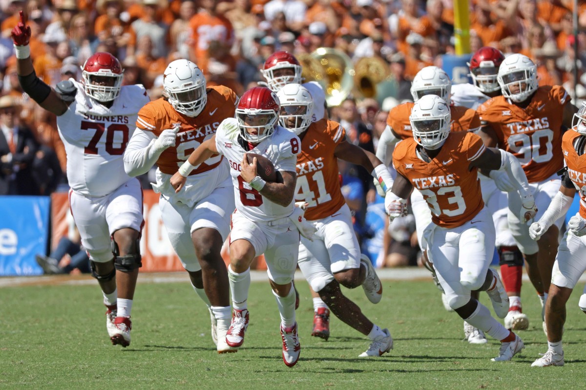 Oklahoma quarterback Dillon Gabriel carries the ball in the Red River Rivalry game against Texas.