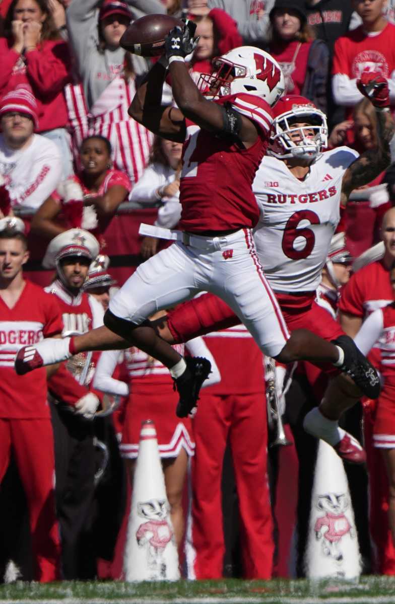 Wisconsin cornerback Ricardo Hallman (2) intercepts a pass intended for Rutgers wide receiver Christian Dremel (6) before returning it 95 yards for a touchdown during the second quarter of their game Saturday, Oct. 7, 2023, at Camp Randall Stadium in Madison, Wisconsin.