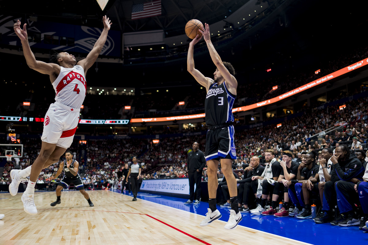 Oct 8, 2023; Vancouver, British Columbia, CAN; Sacramento Kings guard Chris Duarte (3) shoots against Toronto Raptors forward Scottie Barnes (4) in the second half at Rogers Arena. Raptors won 112-99. Mandatory Credit: Bob Frid-USA TODAY Sports  