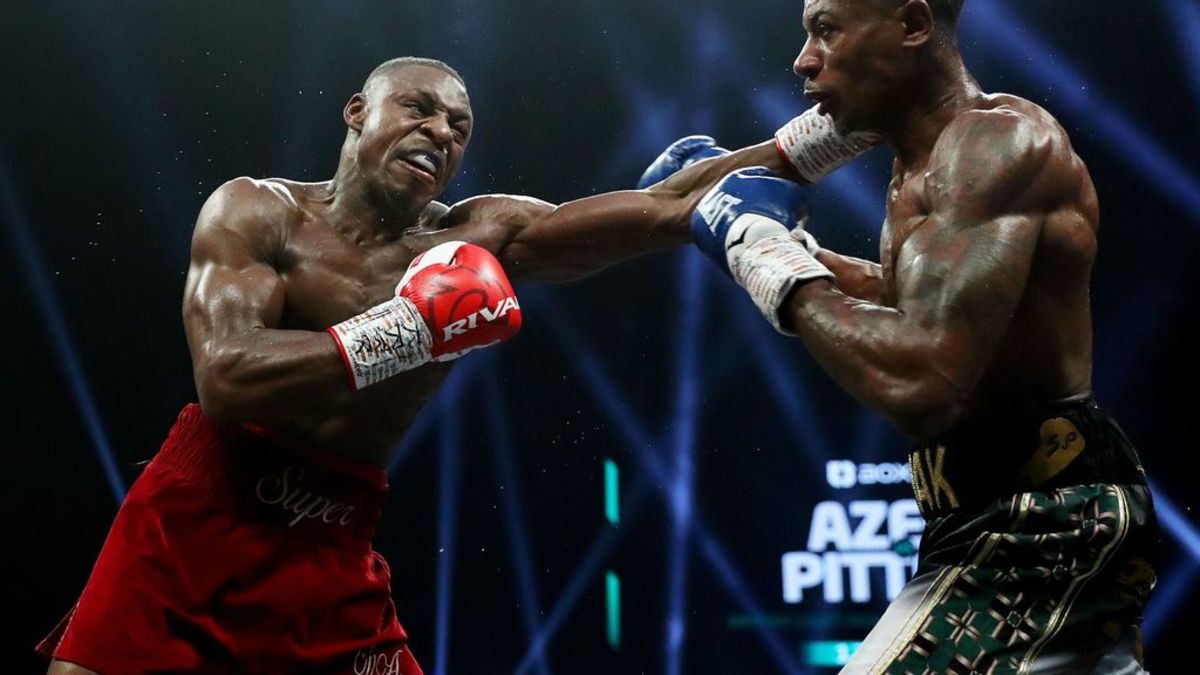 Dan Azeez punches Shaken Pitters during the 12x3 British Light-Heavyweight Title fight. Joshua Buatsi and Dan Azeez, will square off at the OVO Arena Wembley on February 3 at the last eliminator for the WBA champion Dmitry Bivol's title. LEWIS STOREY/GETTY IMAGES.