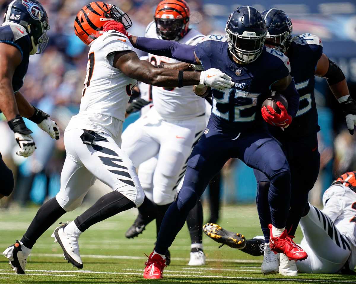 Tennessee Titans running back Derrick Henry (22) stiff arms Cincinnati Bengals linebacker Germaine Pratt (57) during the second quarter at Nissan Stadium in Nashville, Tenn., Sunday, Oct. 1, 2023.