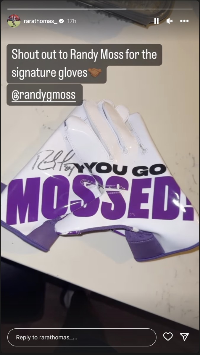 Legendary WR, Randy Moss sent RaRa Thomas a pair of signed gloves. Photo via RaRa Thomas' Instagram story. 