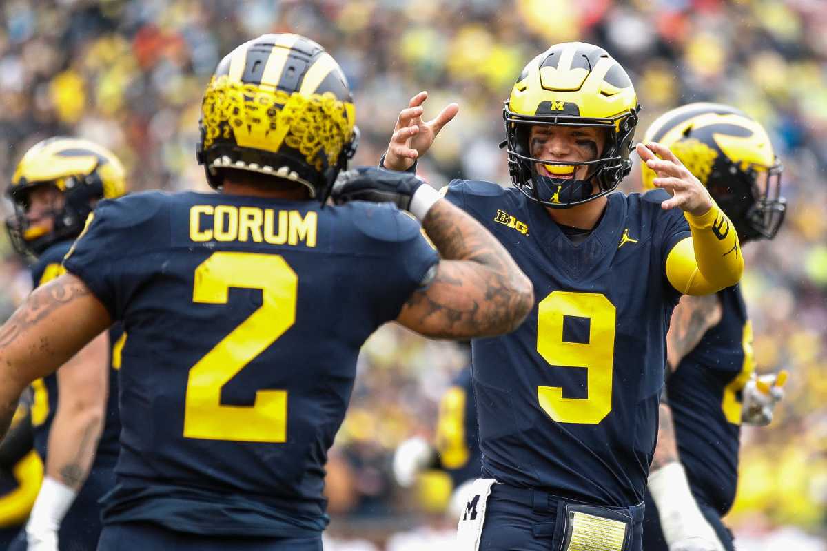 J.J. McCarthy celebrates a touchdown against Indiana scored by running back Blake Corum 