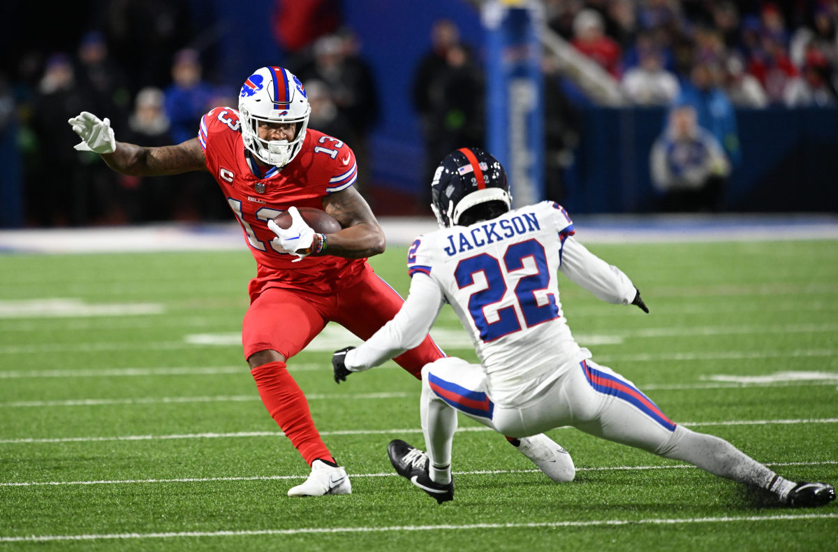 Buffalo Bills wide receiver Gabe Davis (13) tries to avoid a tackle by New York Giants cornerback Adoree' Jackson (22) in the first quarter at Highmark Stadium.