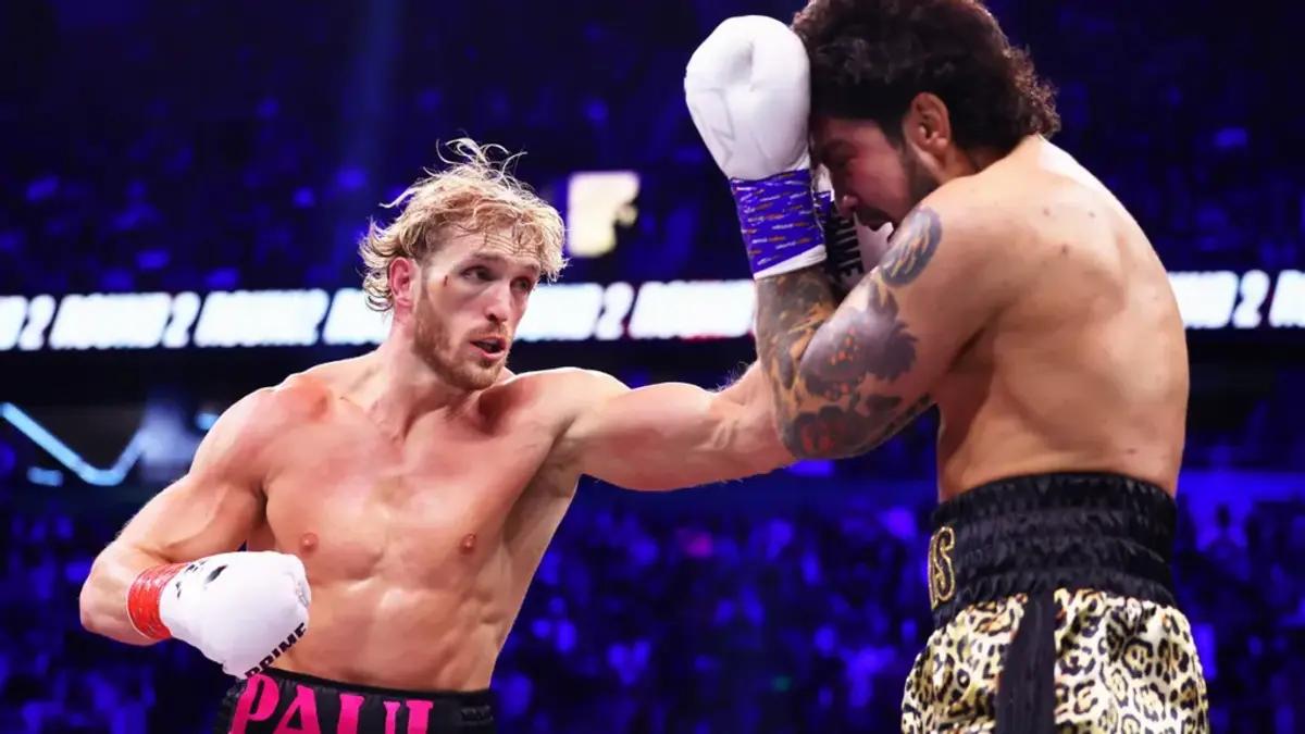 Logan Paul punches Dillon Danis during the Misfits Heavyweight fight in Manchester England. At the end of the sixth and final round on Saturday at the AO Arena in Manchester, England, Dillon Danis attempted to pull Logan Paul to the ground, which resulted in a disqualification for Logan Paul. MATT MCNULTY VIA GETTY IMAGES