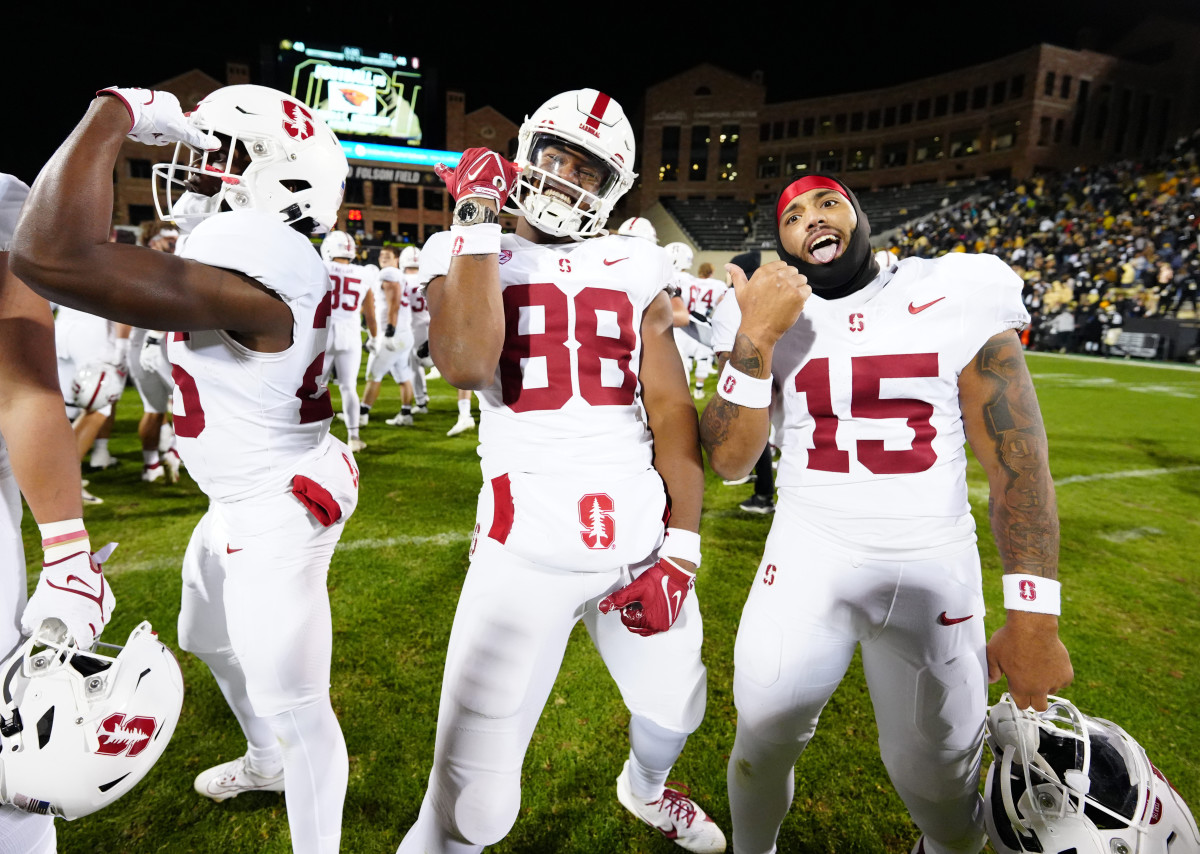 Oct 13, 2023; Boulder, Colorado, USA; Stanford Cardinal tight end C.J. Hawkins (88) and running back Ryan Butler (15) and wide receiver Ismael Cisse (25) celebrate defeating the Colorado Buffaloes in double overtime at Folsom Field. Mandatory Credit: Ron Chenoy-USA TODAY Sports