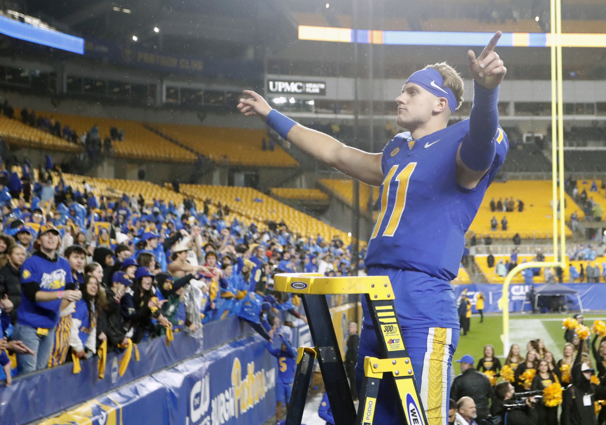 Oct 14, 2023; Pittsburgh, Pennsylvania, USA; Pittsburgh Panthers quarterback Christian Veilleux (11) leads the PITT band in the playing of the Alma Mater after defeating the Louisville Cardinals at Acrisure Stadium. Pittsburgh won 38-21. Mandatory Credit: Charles LeClaire-USA TODAY Sports