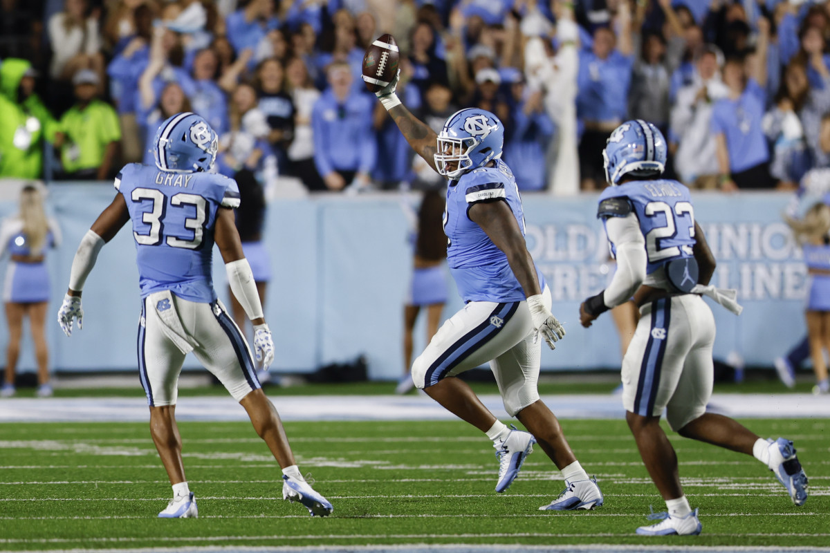 Oct 14, 2023; Chapel Hill, North Carolina, USA; North Carolina Tar Heels defensive lineman Myles Murphy (8) celebrates after recovering a fumble against the Miami Hurricanes in the second half at Kenan Memorial Stadium. Mandatory Credit: Nell Redmond-USA TODAY Sports 