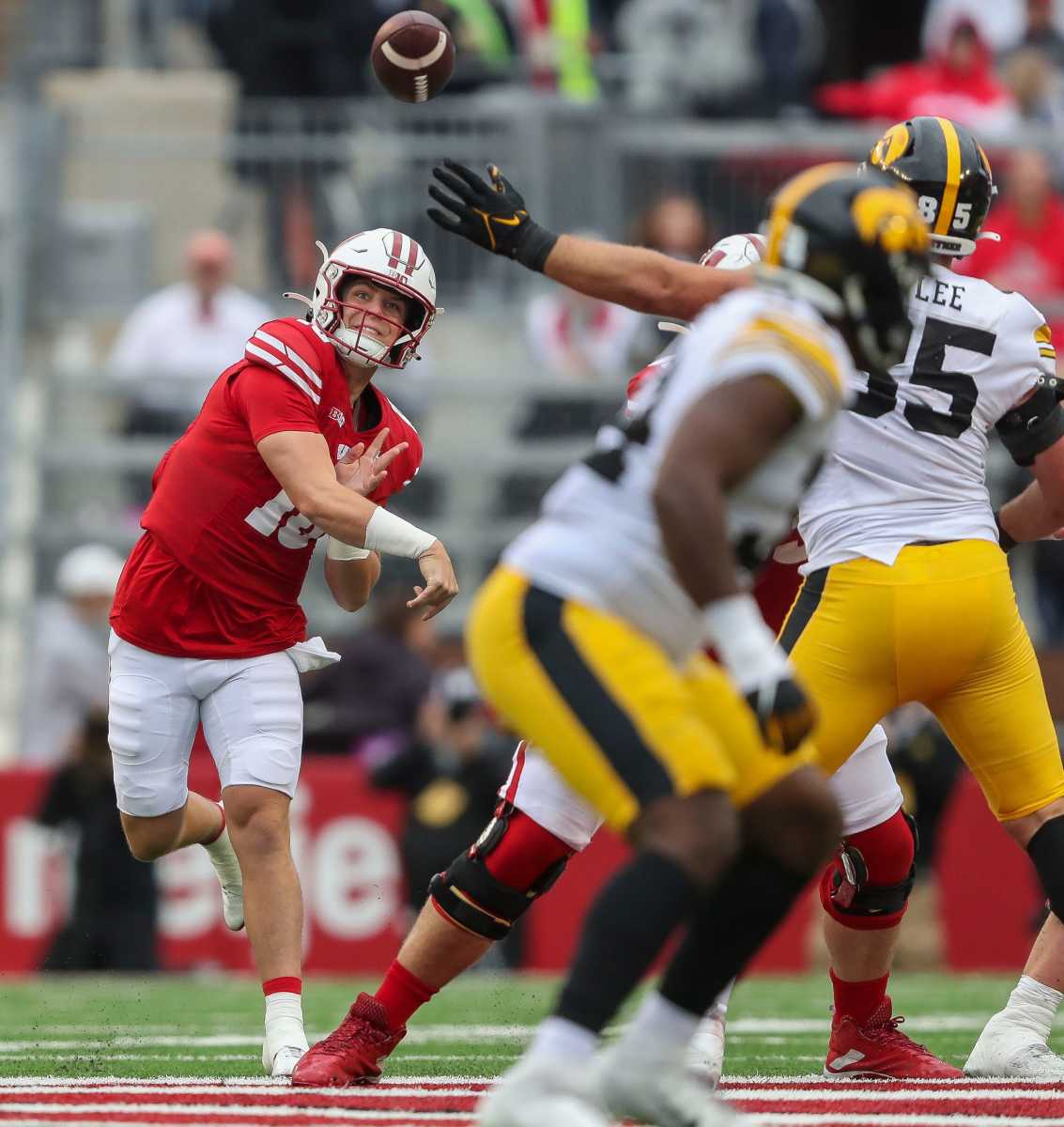 Wisconsin quarterback Braedyn Locke (18) passes the ball against Iowa on Saturday, October 14, 2023, at Camp Randall Stadium in Madison, Wis. Iowa won the game, 12-6.