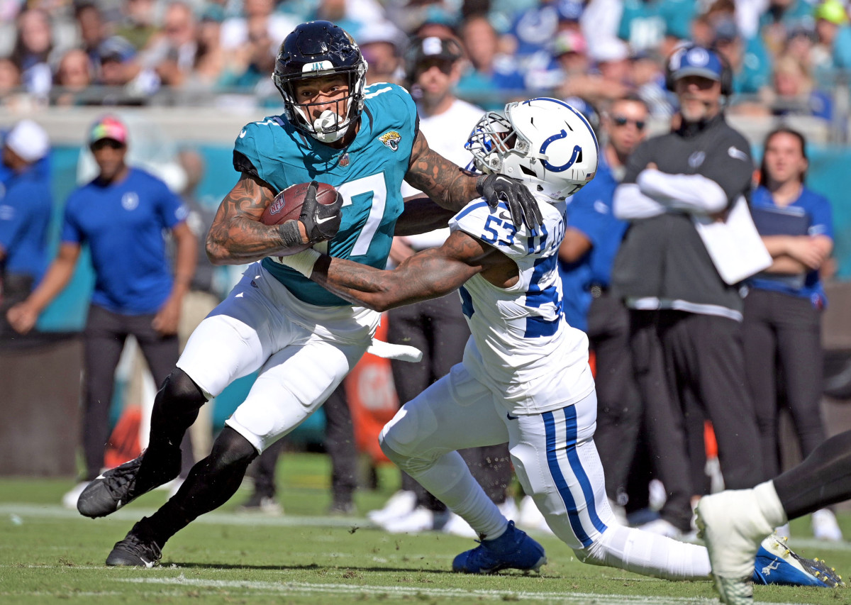 Oct 15, 2023; Jacksonville, Florida, USA; Jacksonville Jaguars tight end Evan Engram (17) is tackled by Indianapolis Colts linebacker Shaquille Leonard (53) during the game at EverBank Stadium. Mandatory Credit: Melina Myers-USA TODAY Sports