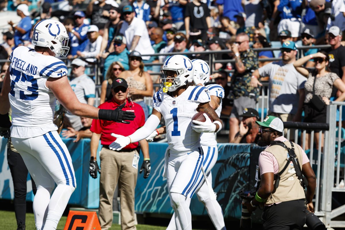 Oct 15, 2023; Jacksonville, Florida, USA; Indianapolis Colts wide receiver Josh Downs (1) and tackle Blake Freeland (73) celebrate a touchdown against the Jacksonville Jaguars during the fourth quarter at EverBank Stadium. Mandatory Credit: Morgan Tencza-USA TODAY Sports