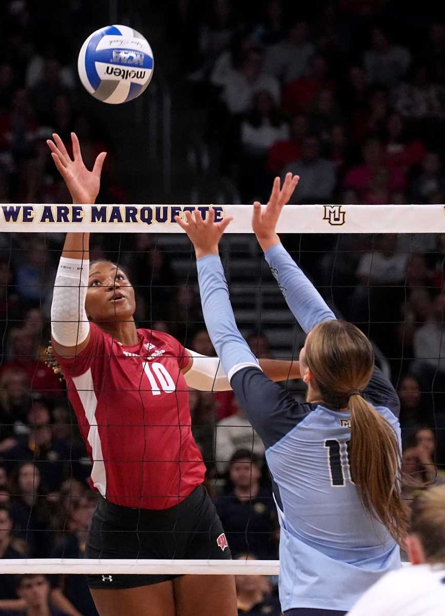 Wisconsin middle blocker Devyn Robinson (10) hits a shot during their volleyball match against Marquette Wednesday, September 13, 2023 at Fiserv Forum in Milwaukee, Wis. Official attendance was 17,037 making it the largest indoor regular-season crowd for a volleyball match in NCAA history and the largest crowd to see a women s sporting event in Wisconsin history.