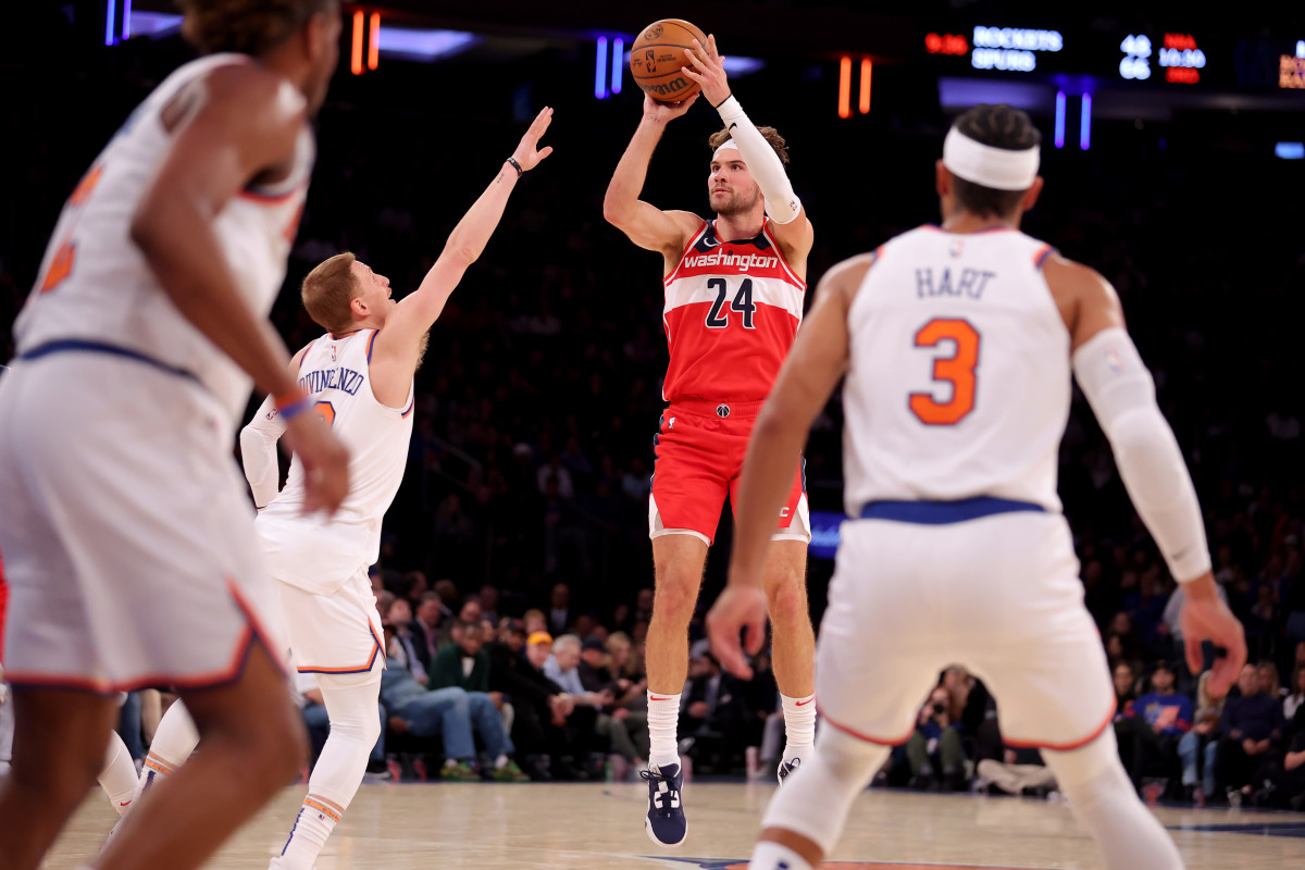 Oct 18, 2023; New York, New York, USA; Washington Wizards forward Corey Kispert (24) takes a shot against New York Knicks guard Donte DiVincenzo (0) during the fourth quarter at Madison Square Garden. Mandatory Credit: Brad Penner-USA TODAY Sports