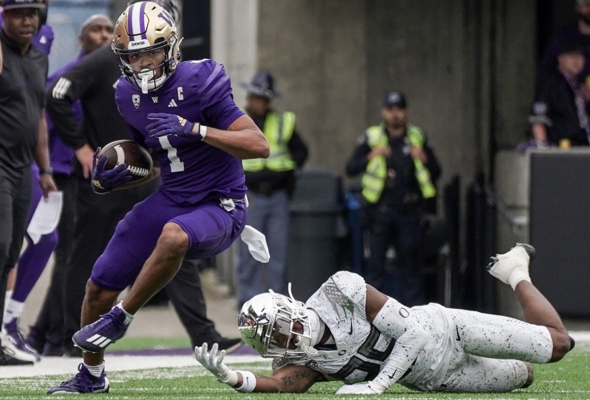 Rome Odunze leaves an Oregon defender grasping at air and falling to the turf in last Saturday's game.