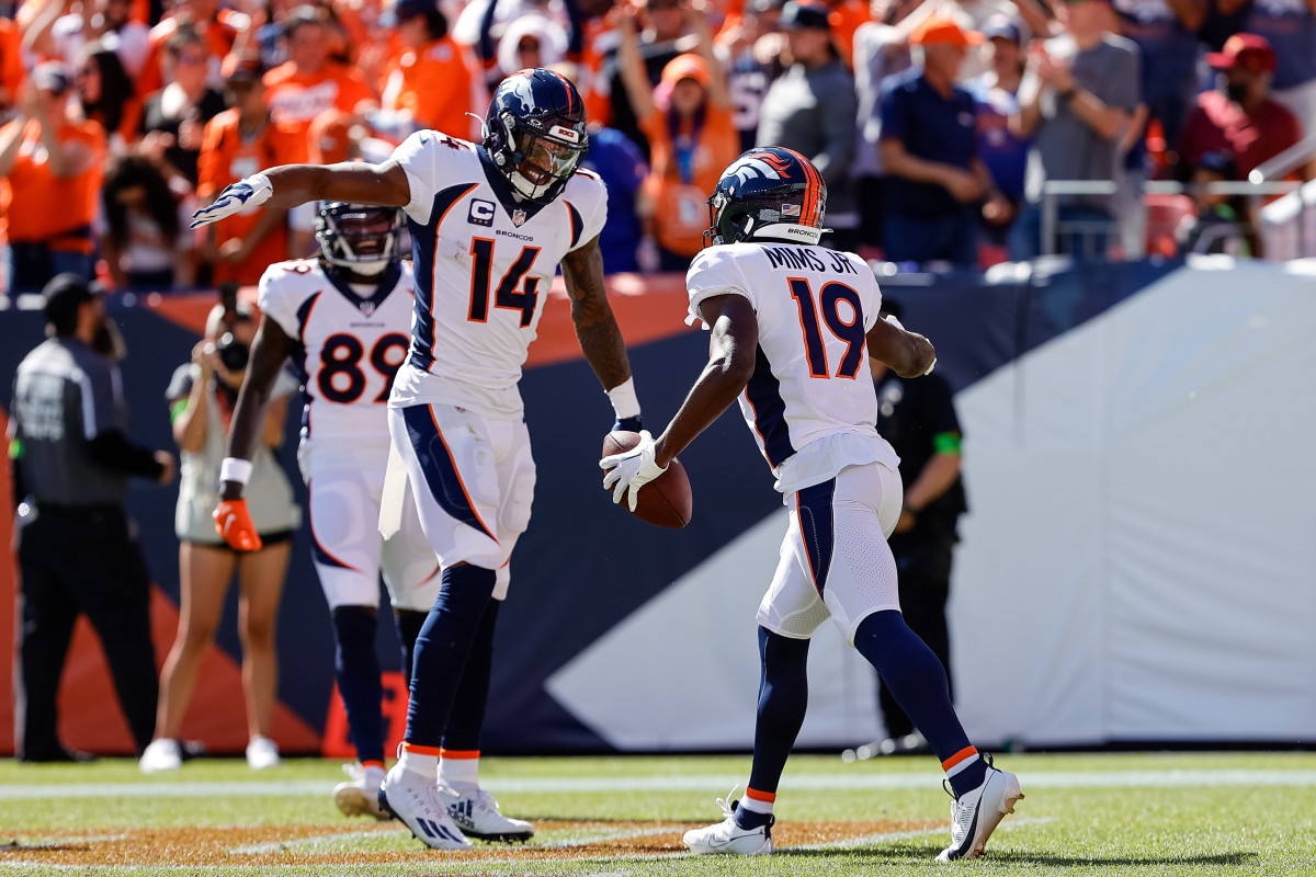 Courtland Sutton high fives Marvin Mims Jr.