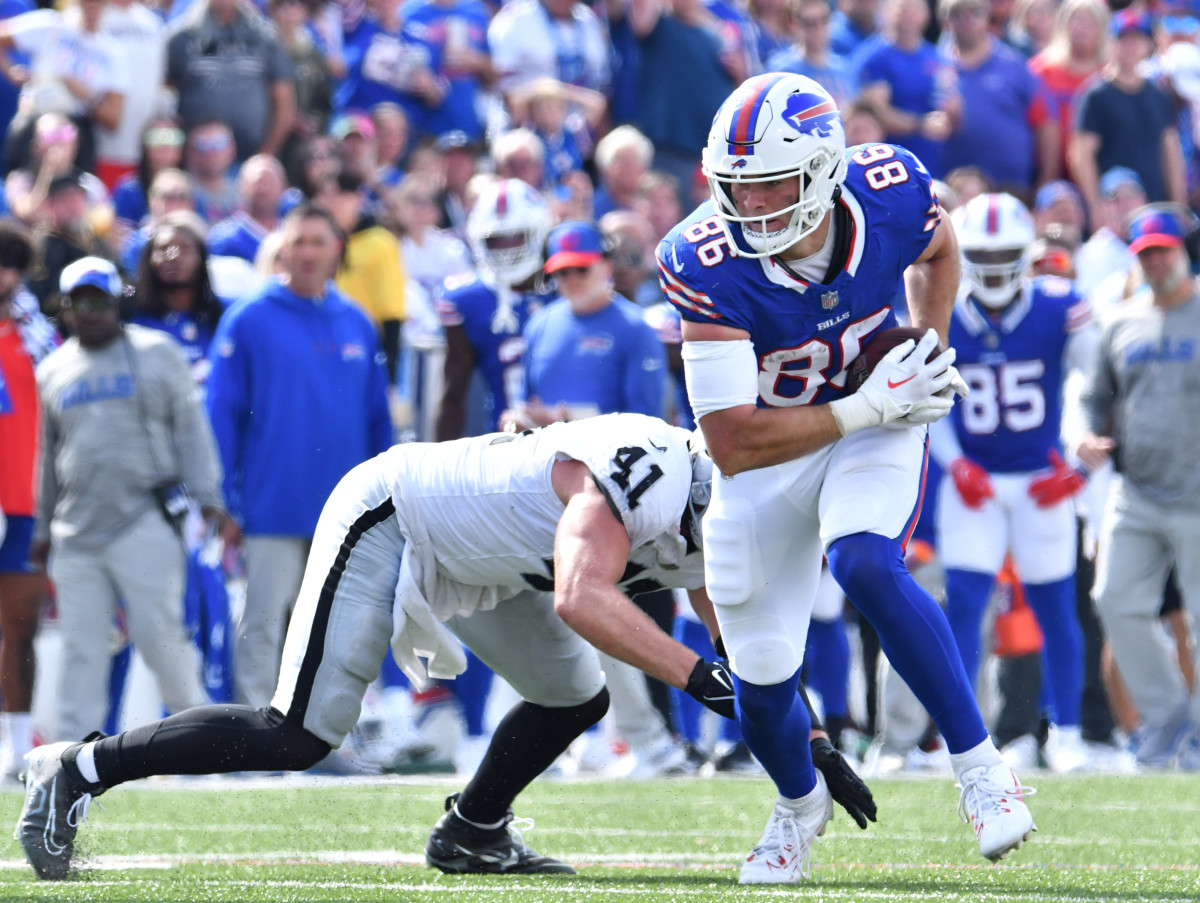 Buffalo Bills tight end Dalton Kincaid (86) avoids a tackle by Las Vegas Raiders linebacker Robert Spillane (41) after a catch in the third quarter at Highmark Stadium.