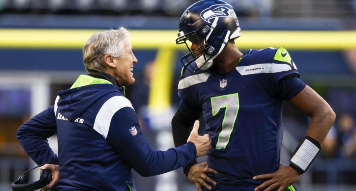 Pete Carroll (left) and Geno Smith