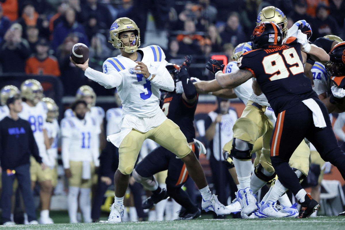 Oct 14, 2023; Corvallis, Oregon, USA; UCLA Bruins quarterback Dante Moore (3) throws a pass while under pressure from Oregon State Beavers defensive lineman Isaac Hodgins (99) during the second half at Reser Stadium. Mandatory Credit: Soobum Im-USA TODAY Sports