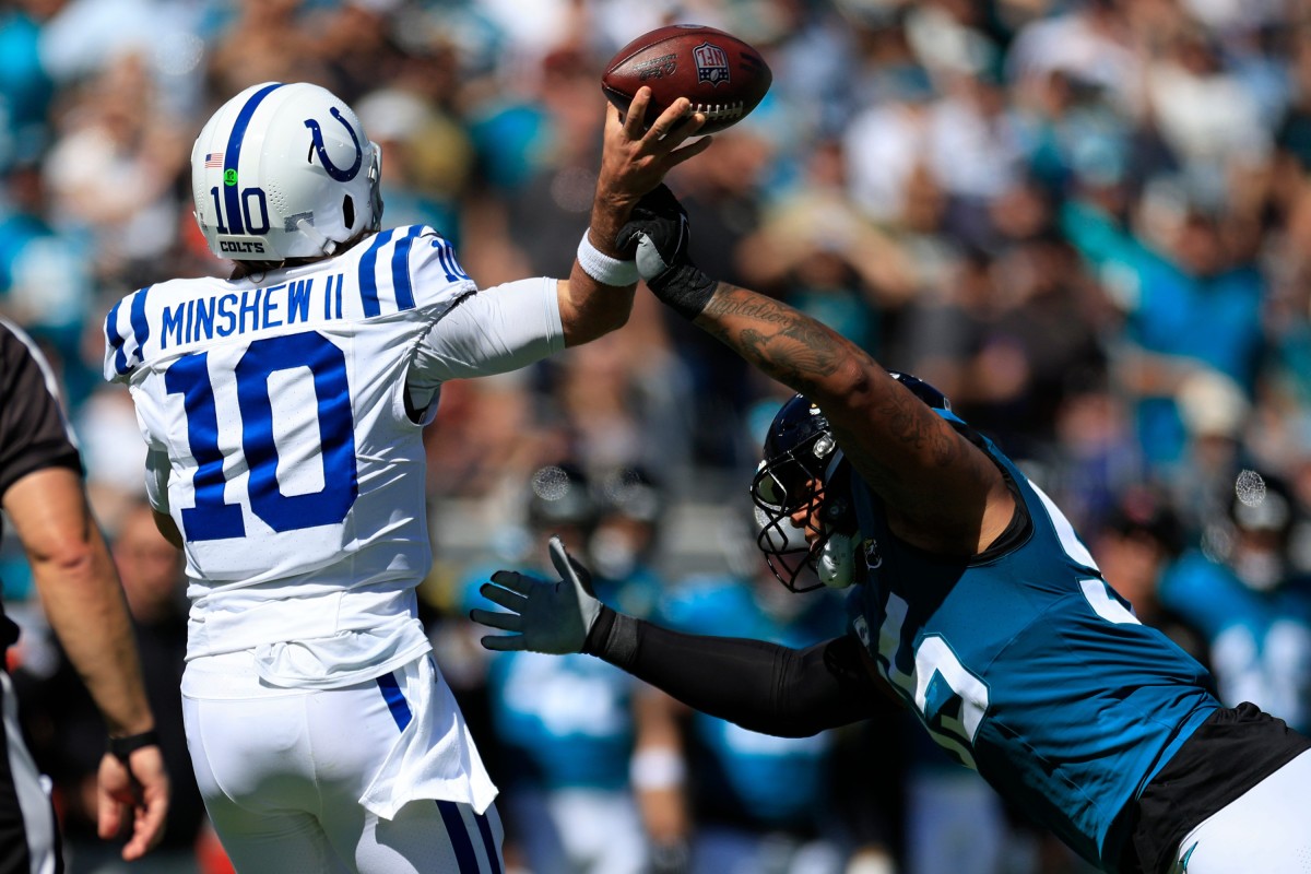 Jacksonville Jaguars defensive end Roy Robertson-Harris (95) hurries Indianapolis Colts quarterback Gardner Minshew (10) during the second quarter of an NFL football matchup Sunday, Oct. 15, 2023 at EverBank Stadium in Jacksonville, Fla. The Jacksonville Jaguars defeated the Indianapolis Colts 37-20. [Corey Perrine/Florida Times-Union]