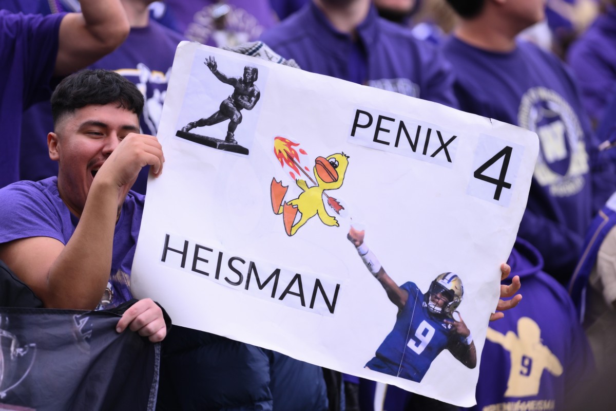 Husky fans show off their Penix artwork.