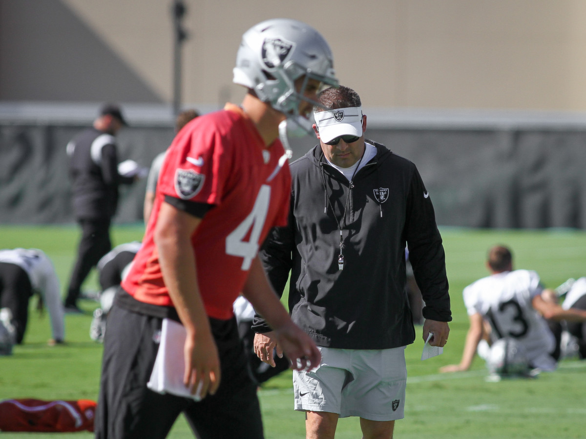 Josh McDaniels watching Aidan O'Connell's footwork