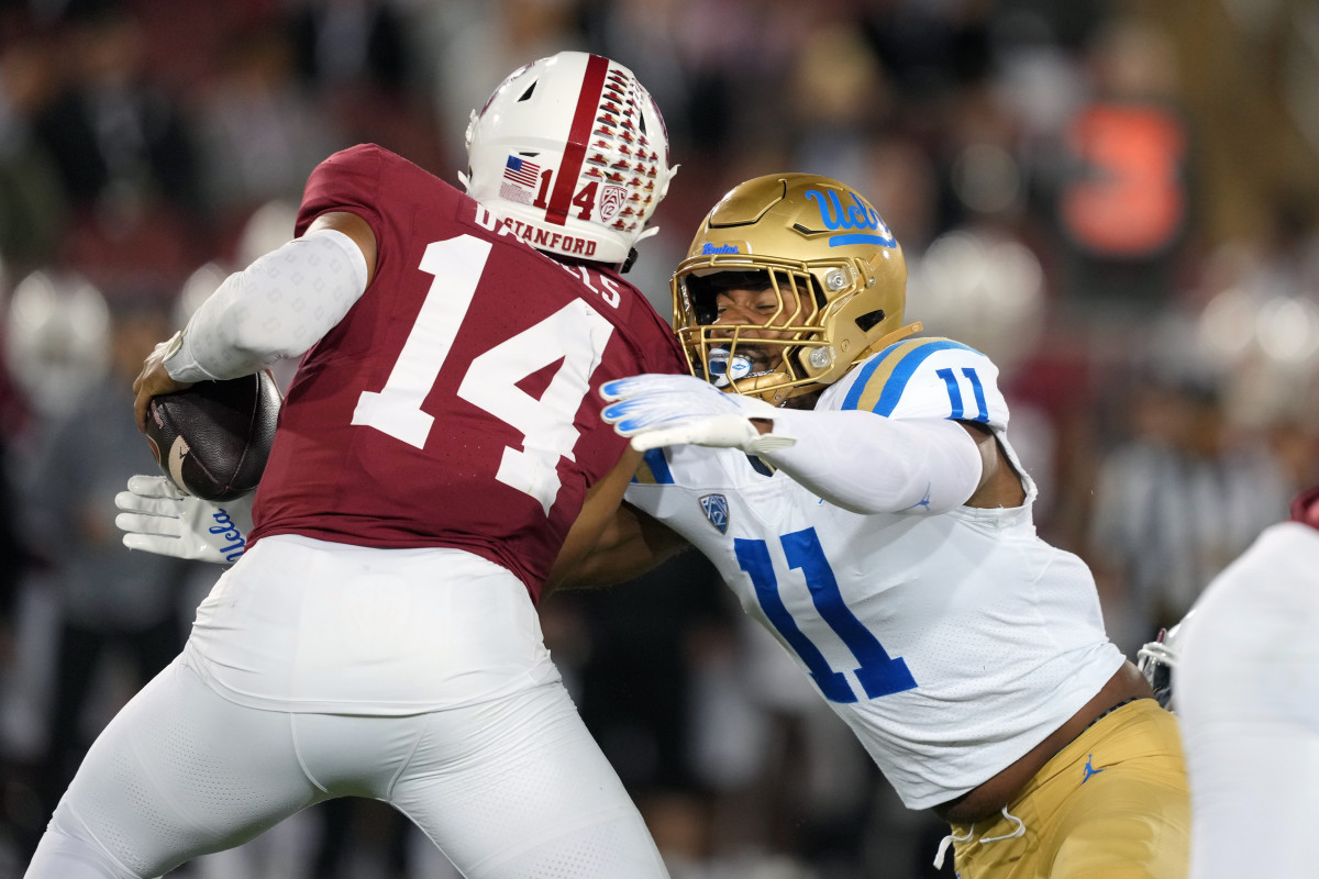 Oct 21, 2023; Stanford, California, USA; UCLA Bruins defensive lineman Gabriel Murphy (11) sacks Stanford Cardinal quarterback Ashton Daniels (14) during the first quarter at Stanford Stadium. Mandatory Credit: Darren Yamashita-USA TODAY Sports