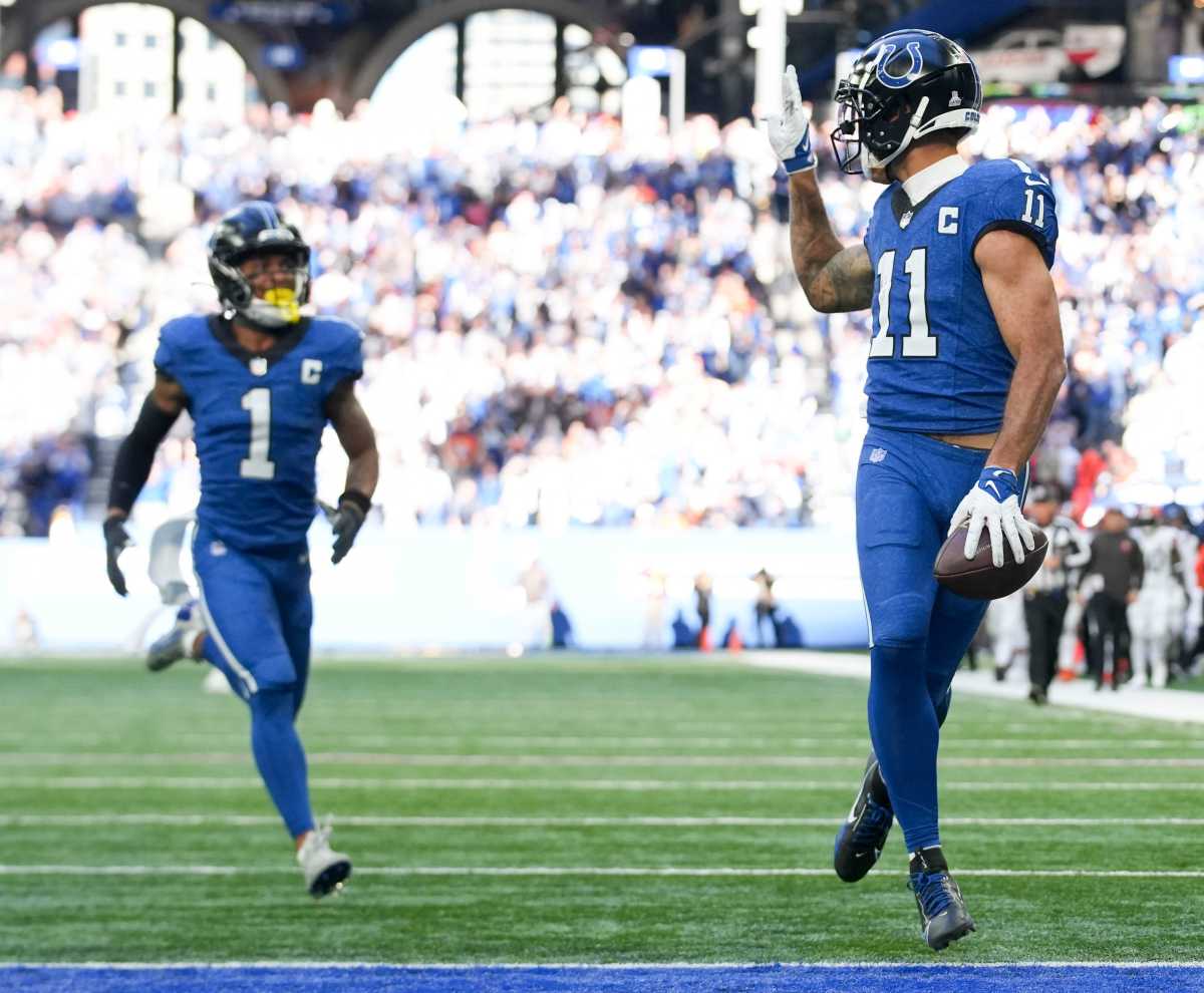 Indianapolis Colts wide receiver Michael Pittman Jr. (11) looks back and throws up a peace sign as he runs into the end zone Sunday, Oct. 22, 2023, during a game against the Cleveland Browns at Lucas Oil Stadium in Indianapolis.  