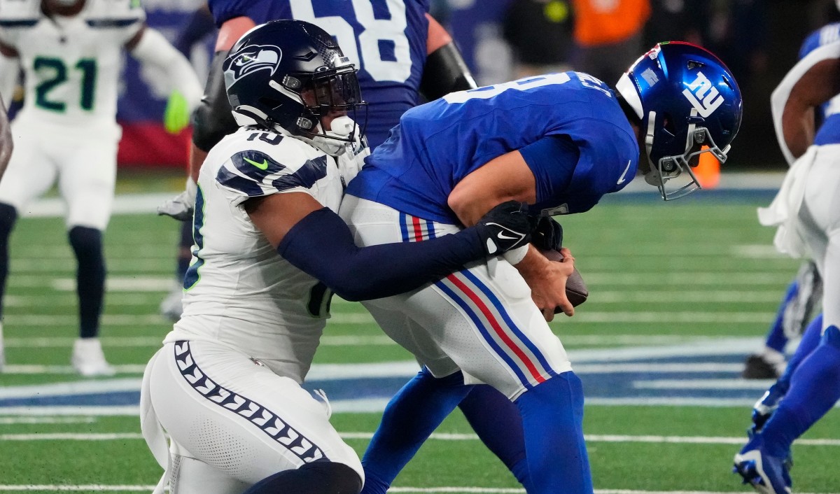 New York Giants quarterback Daniel Jones (8) is sacked by Seattle Seahawks linebacker Uchenna Nwosu (10) in the second half at MetLife Stadium.