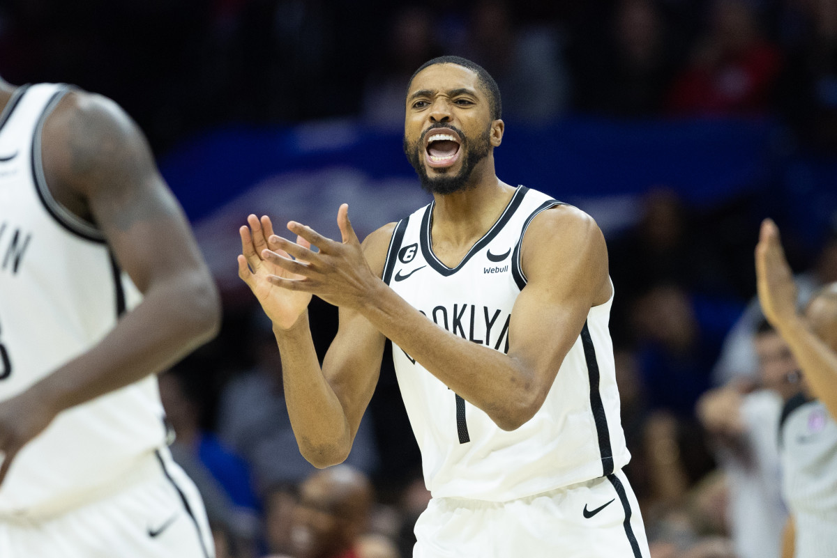 forward Mikal Bridges claps in celebration