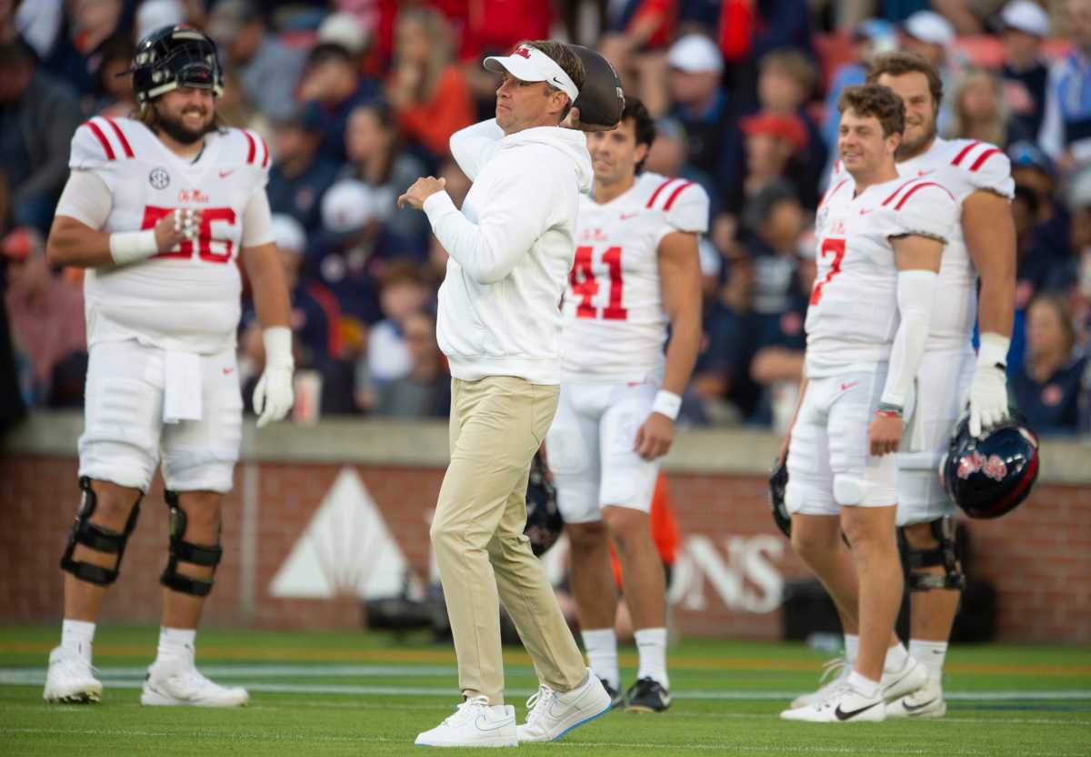 Mississippi Rebels head coach Lane Kiffin throws the ball around during warm ups before Auburn Tigers take on Mississippi Rebels at Jordan-Hare Stadium in Auburn, Ala., on Saturday, Oct. 21, 2023.