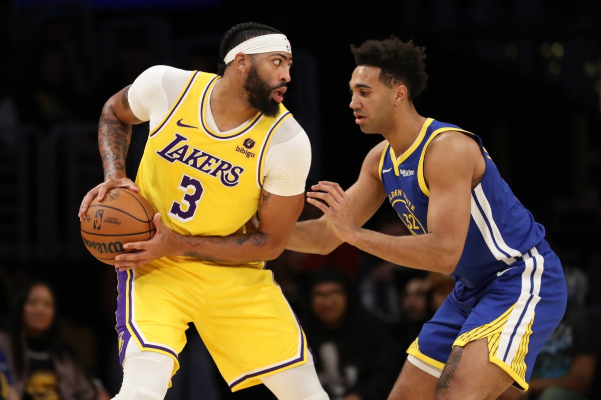 Los Angeles Lakers forward Anthony Davis (3) matches up against Golden State Warriors forward Trayce Jackson-Davis (32) during the first half at Crypto.com Arena.