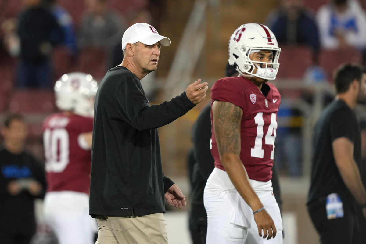 Oct 21, 2023; Stanford, California, USA; Stanford Cardinal head coach Troy Taylor (left) and quarterback Ashton Daniels (14) walk on the field before the game against the UCLA Bruins at Stanford Stadium. Mandatory Credit: Darren Yamashita-USA TODAY Sports