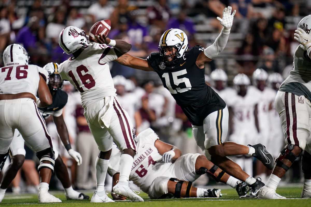 Vanderbilt defensive end Nate Clifton (15) puts pressure on Alabama A&M quarterback Xavier Lankford (16) during the fourth quarter at FirstBank Stadium in Nashville, Tenn.