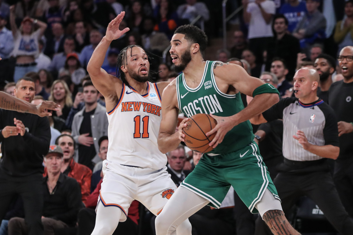 Boston Celtics forward Jayson Tatum (0) is guarded by New York Knicks guard Jalen Brunson (11) while trying to make a pass in the fourth quarter at Madison Square Garden.